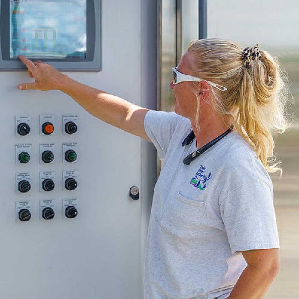 Image of female treatment operator.