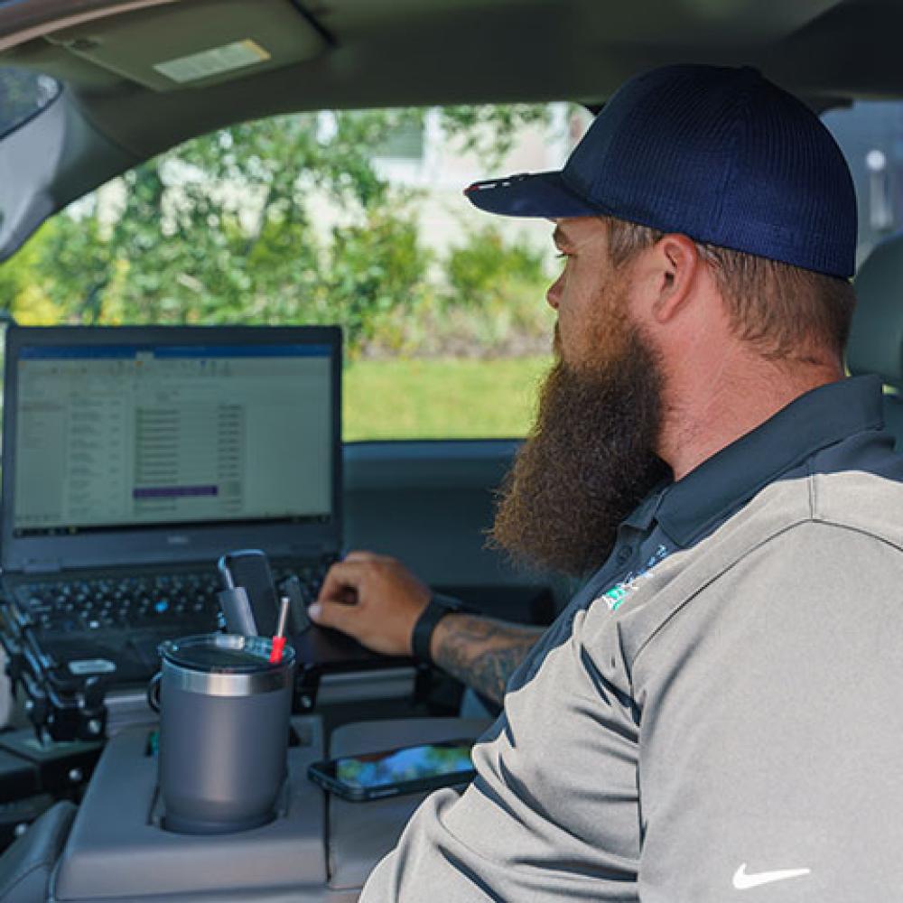 Toho inspector in vehicle viewing computer.
