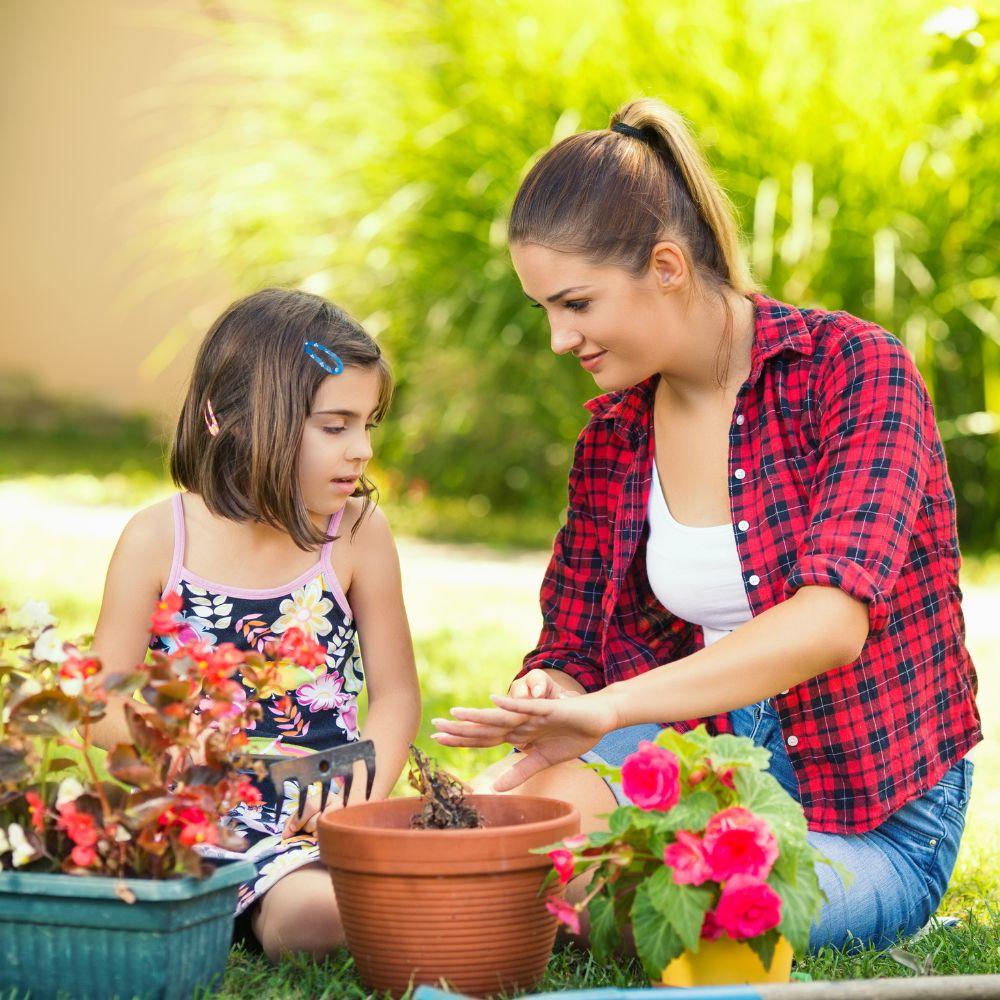 Image of daughter and mother gardening. 