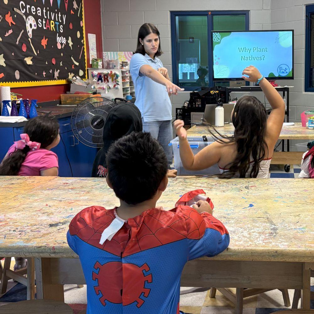Image of Conservation Specialist giving a classroom presentation.