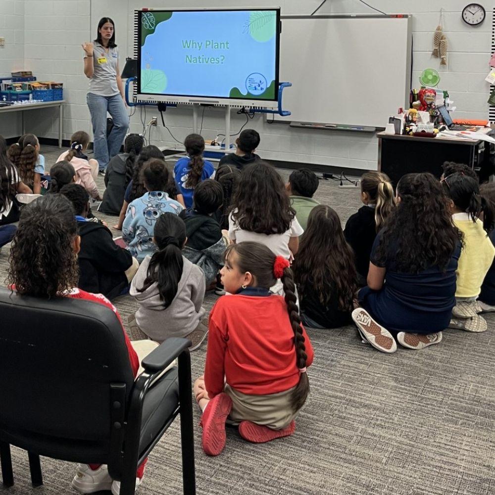 Image of Conservation Specialist giving a classroom presentation.