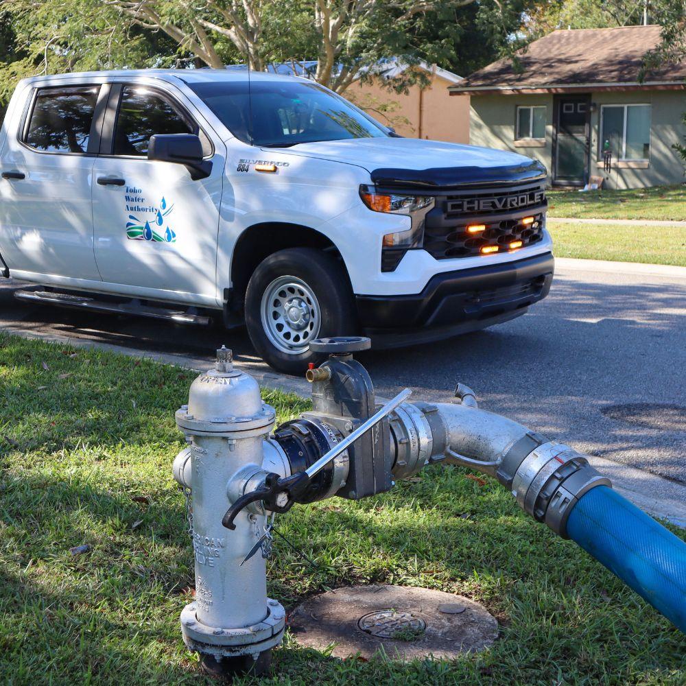 Image of Toho vehicle parked near a fire hydrant. 